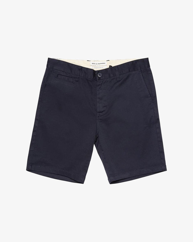 Navy slim fit short with zip fly closure, back welt pockets, coin pocket detail, 63% poly 34% cotton 3% spandex twill fabrication with a garment wash