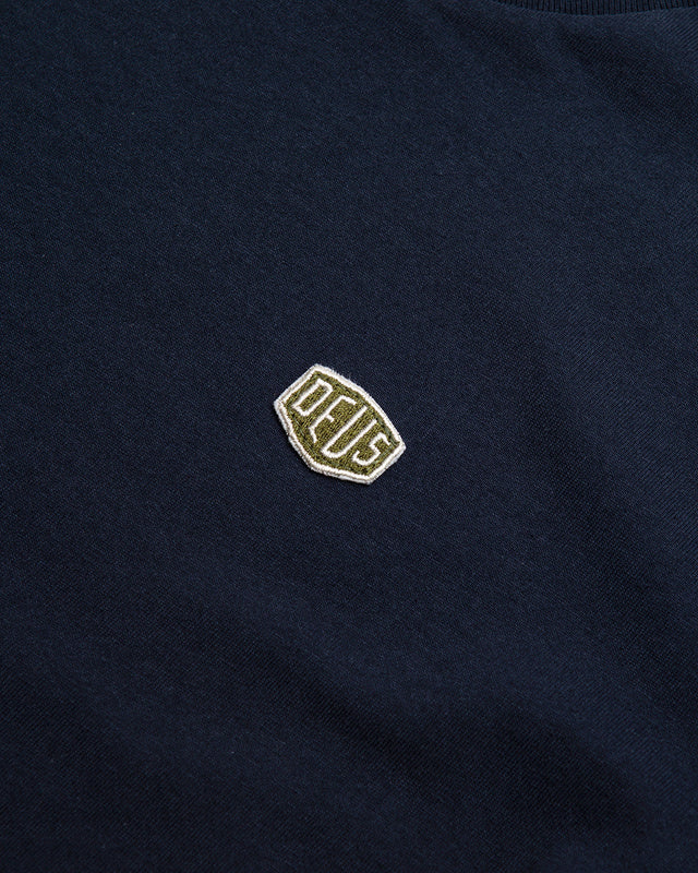 Navy regular fit t-shirt, with chest embroidered shield badge , 190gm oe 100% cotton jersey fabrication with a garment wash