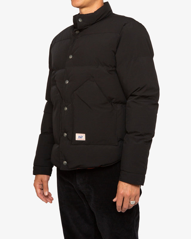black regular fit padded jacket with front patch double entry pockets and internal chest pocket, branded press stud closure, woven branded label, polyamide / spandex water resistant outer shell, nylon lining and polyester wadding fabrication with garment wash