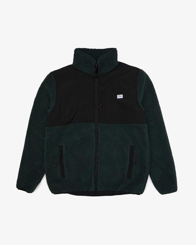 green regular fit fleece with chest label, hem and chest zip pockets, bonded poly and cotton fleece fabrication with 85% nylon 15% polyester water resistant contrast shell panel