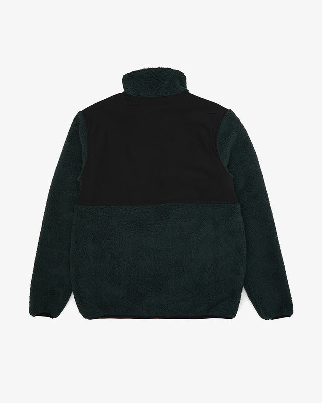 regular fit green fleece with chest label, hem and chest zip pockets, bonded poly and cotton fleece fabrication with 85% nylon 15% polyester water resistant contrast shell panel